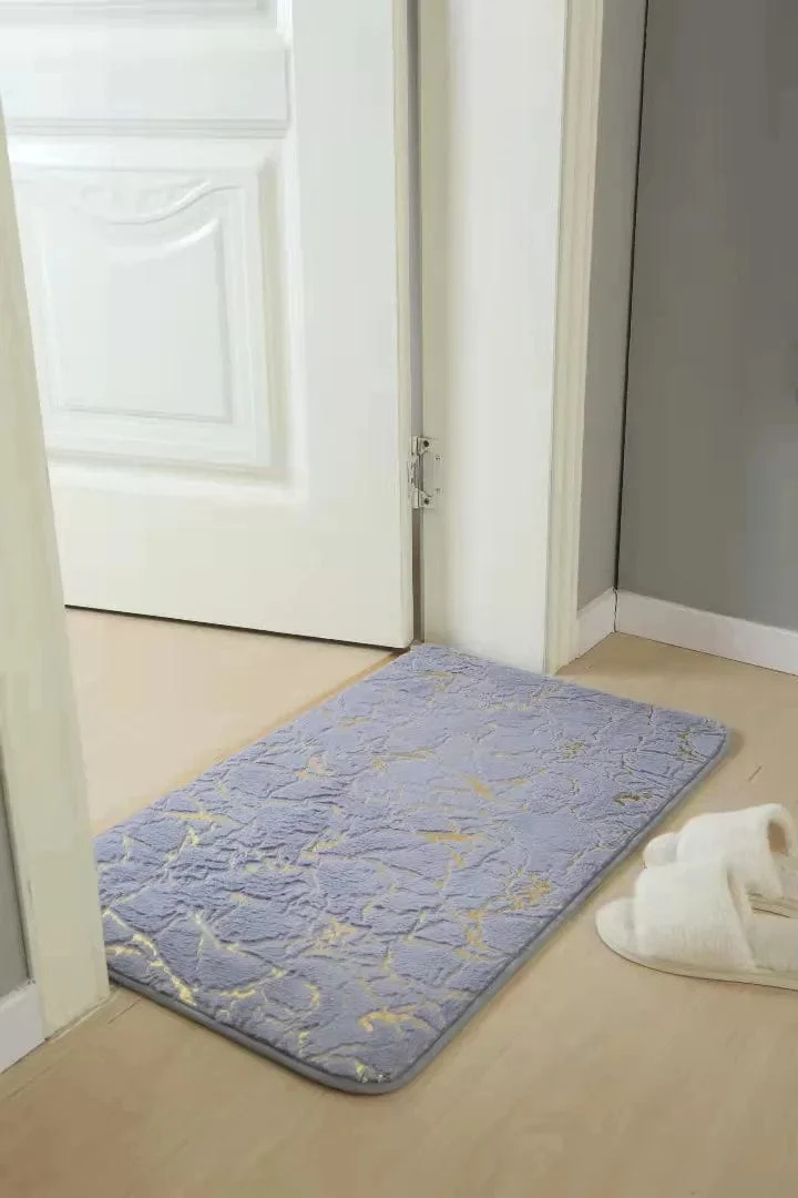 Tapis de bain gris et doré